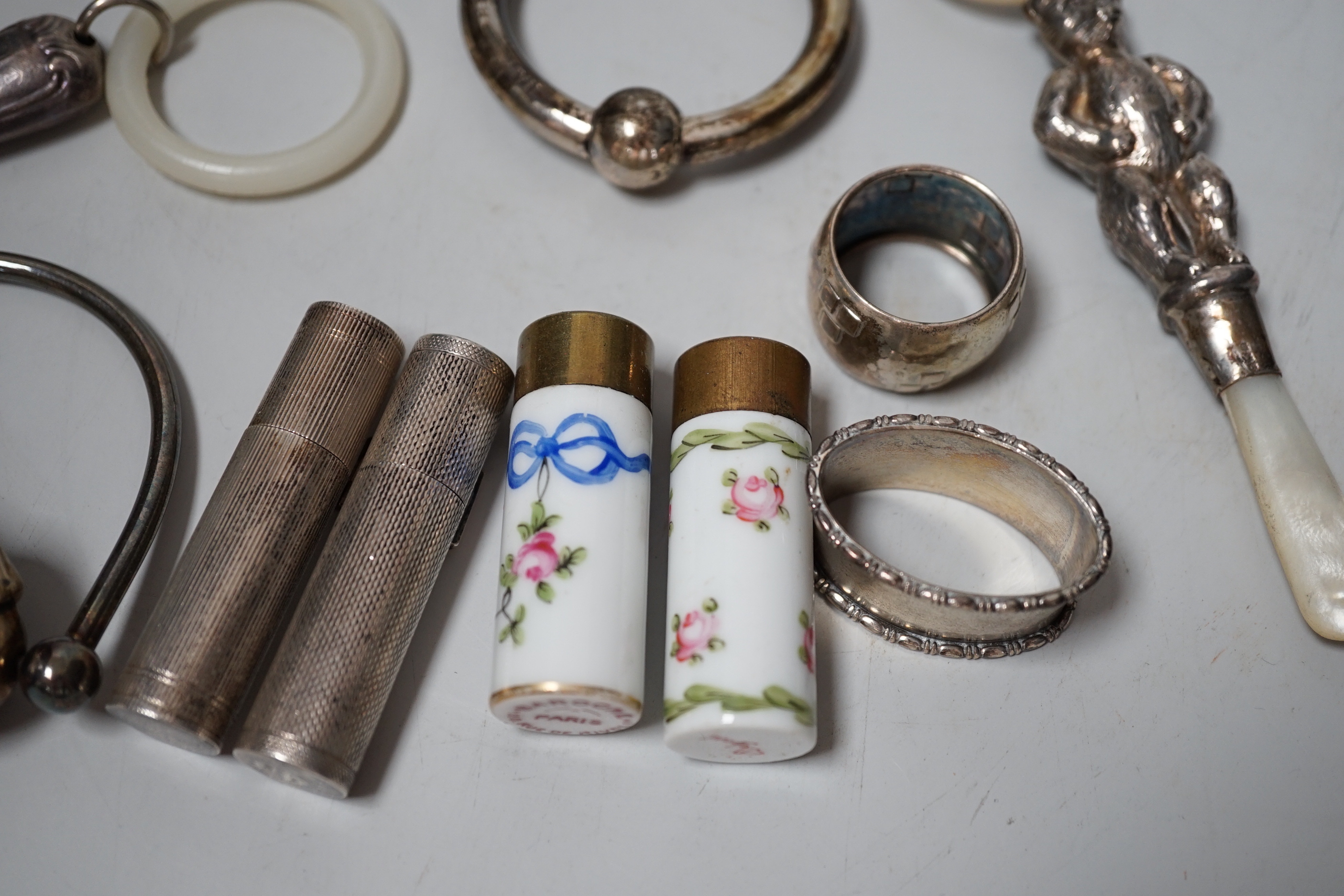 Sundry small silver and other items including teethers, rattles, Asprey & Co silver mounted lighter, etc.